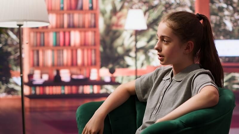 teen girl talking with counsellor in scholl