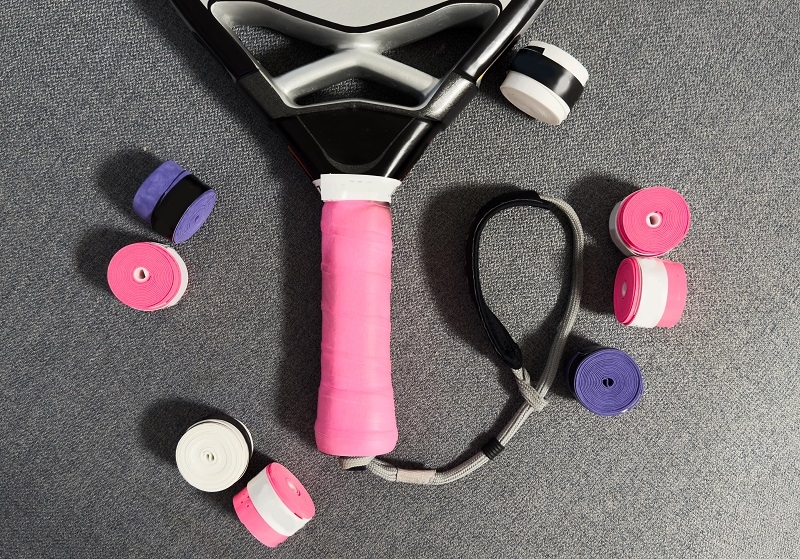  Player changing racquet tennis grip Person replacing overgrip
