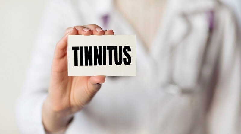 man holding tinnitus text 