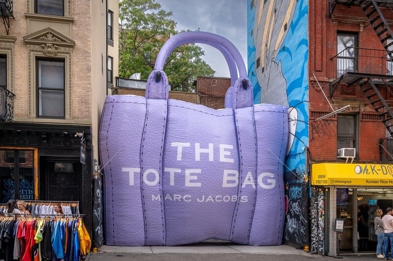 big tote bag on road side for promotion