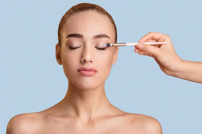 woman touching of neutral makeup