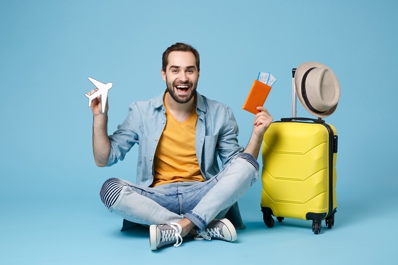 Air flight journey Sit near suitcase hold passport boarding pass tickets air plane
