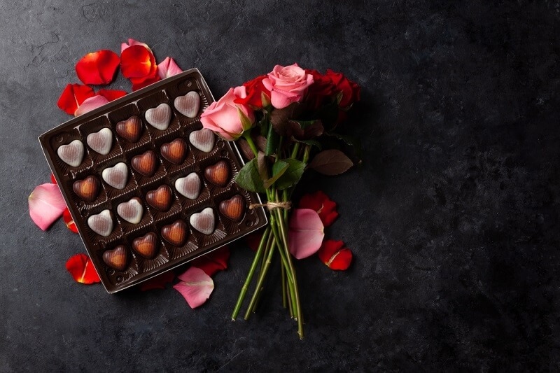 Valentine flowers with chocolate candies