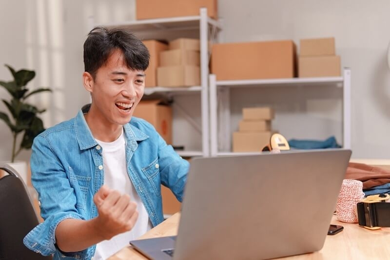 young asian male attanding virtual conferencer on emerging markets