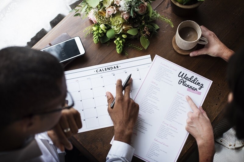 woman checking with wedding planner