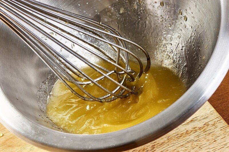 whisking egg yolk in steel conatiner
