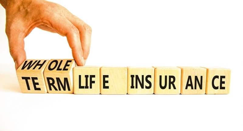 man arranging whole and term life insurance blocks