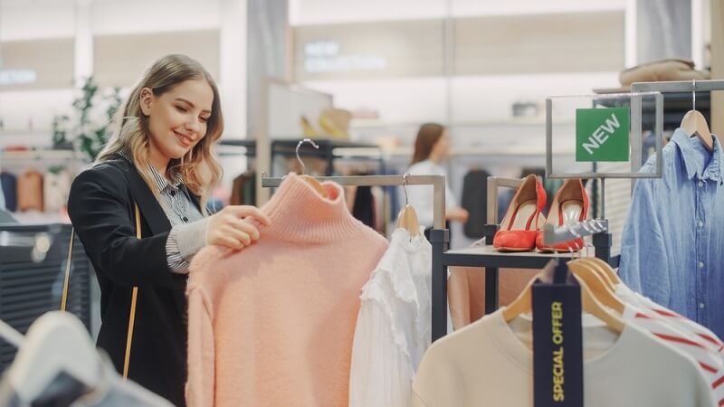 beautiful woman doing winter shopping in store
