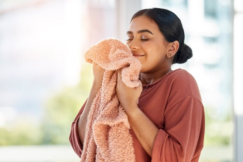 woman smelling and loving the fragrance