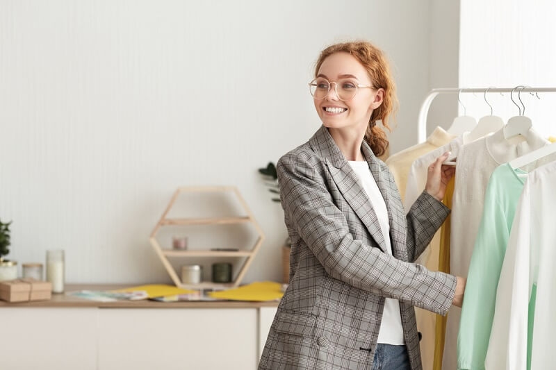 woman arranging her closet