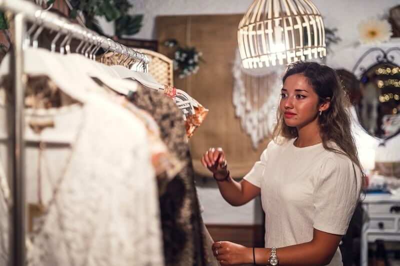 beautiful woman choosing clothes