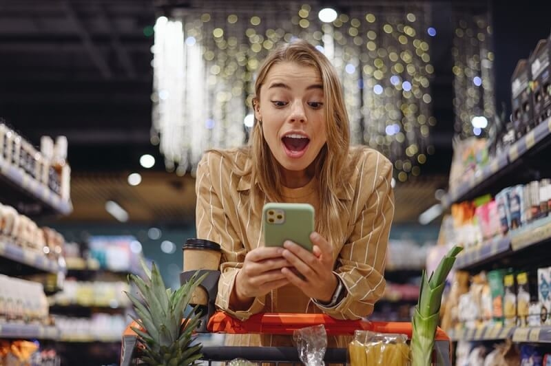 woman feeling happy after getting savings on shopping