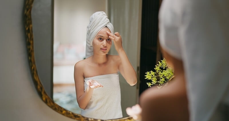 woman doing skincare routine step