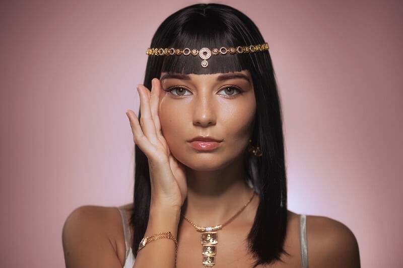 beautiful women in gold headpieces