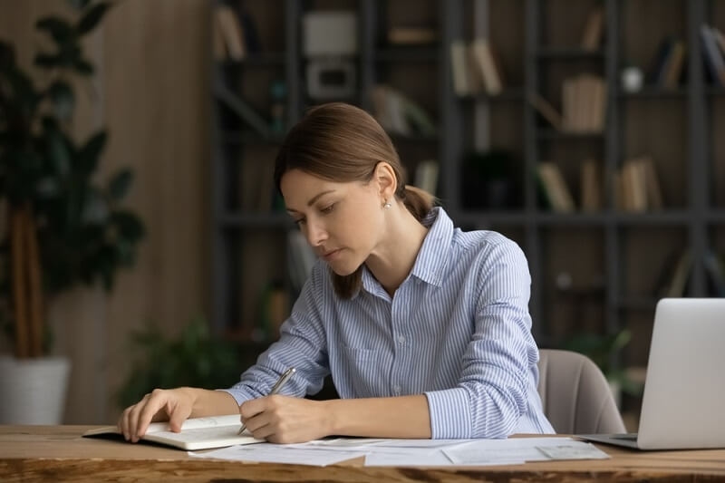 woman keeping track of all expenses