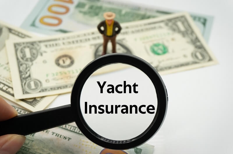 yacht insurance through magnifying glass 