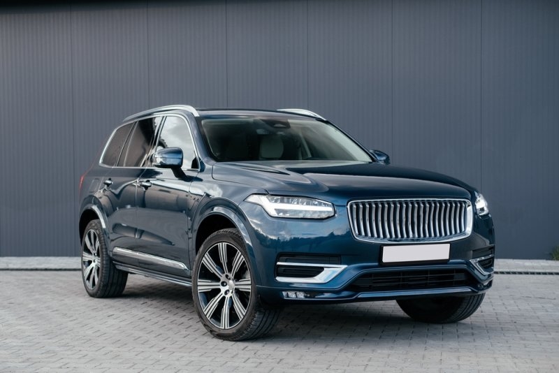 A blue luxury SUV shown from the front.