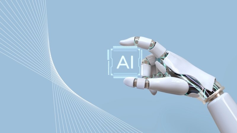 Robotic hand holding an Ai labelled microchip