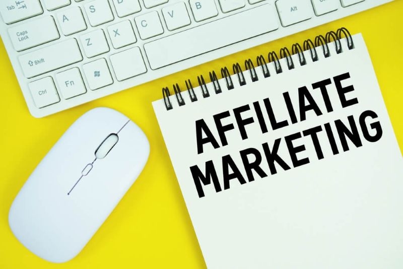  Text Affiliate Marketing  on a notepad with keyboard and mouse on side