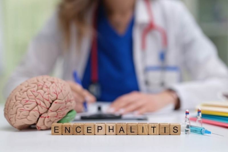 encephalitis text on wooden blocks on doctor's table