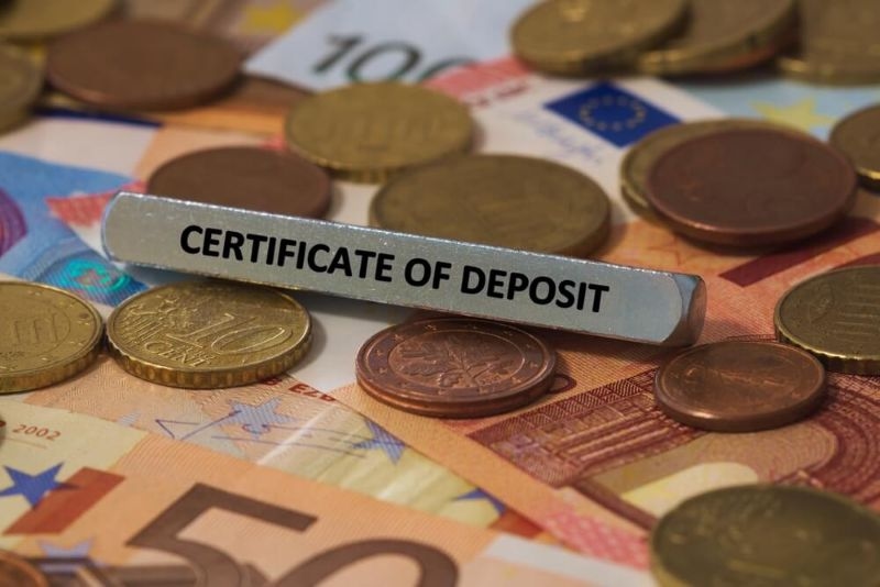 Text Certificate of Deposit  printed on a metal bar