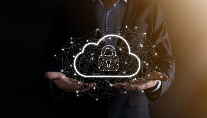 Business man holding cloud computing data and security on global networking