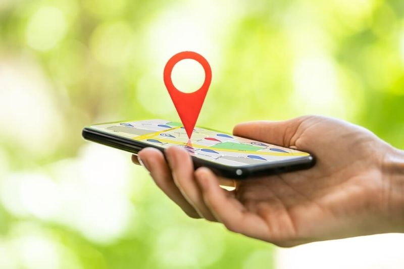 Local red gps marker on top of a phone