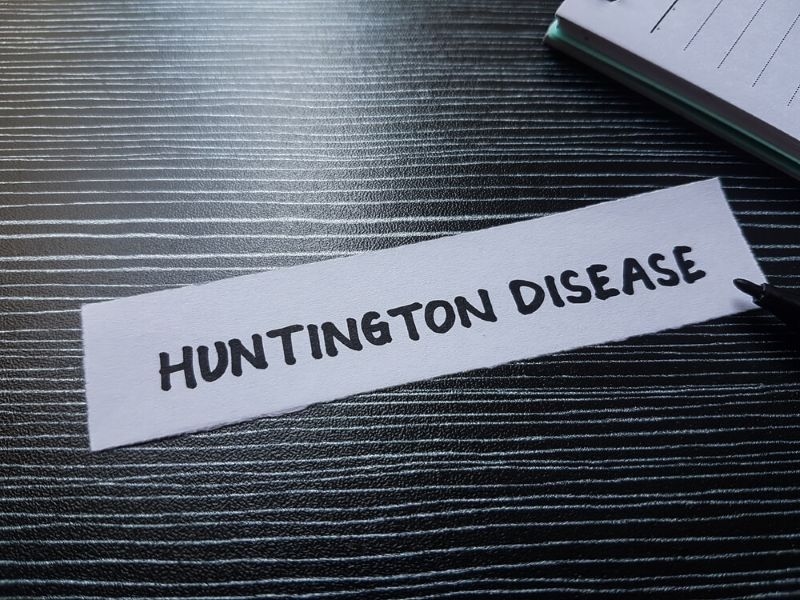 Text Huntington’s disease on a piece of paper kept on a table