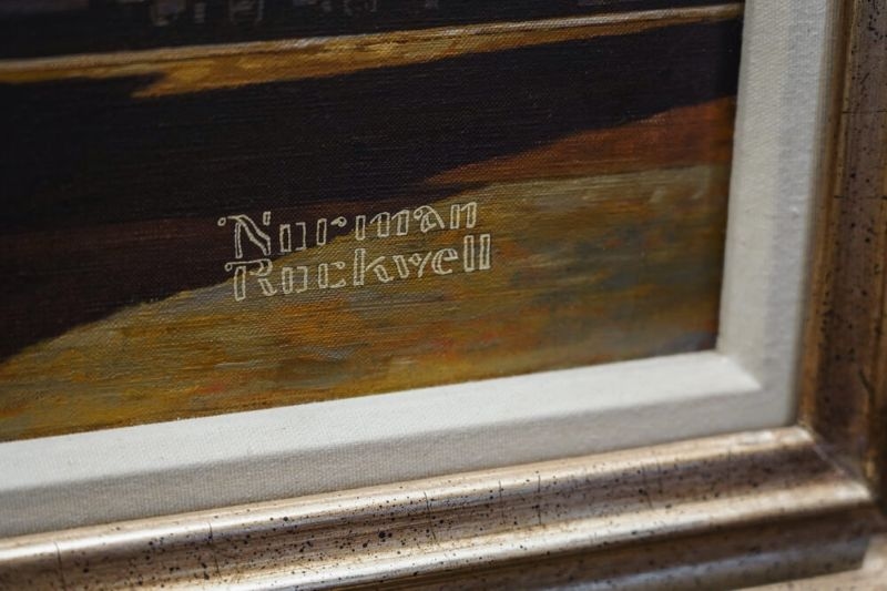 Norman Rockwell's signature printed on a painting