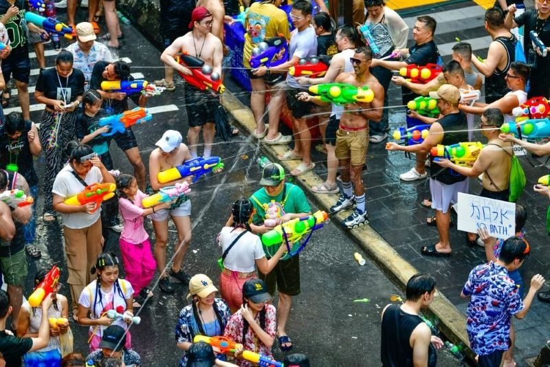 Hundreds tourists from around the world gather for the Songkran Festival in Silom