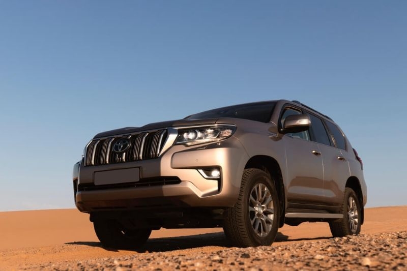 Toyota Land Cruiser Prado standing in the middle of the desert
