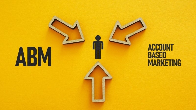 Arrows pointing toward a target customer to illustrate account-based marketing.