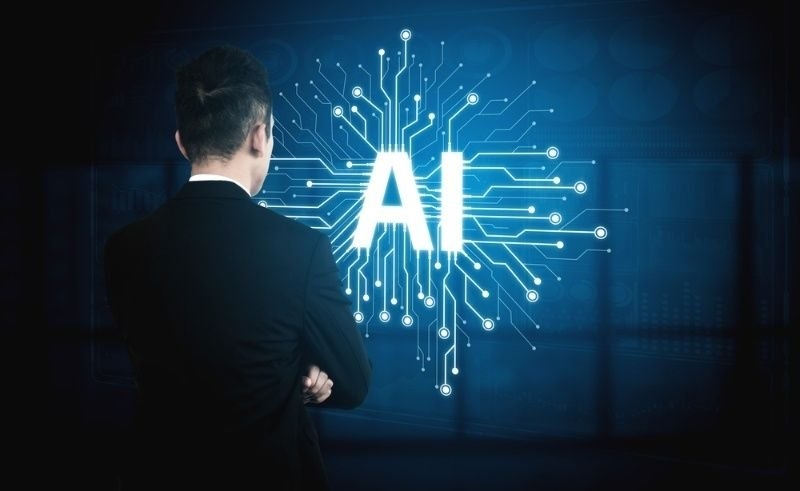 A businessman faces a glowing digital