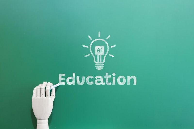 Ai Education text on board with robotic arm writing