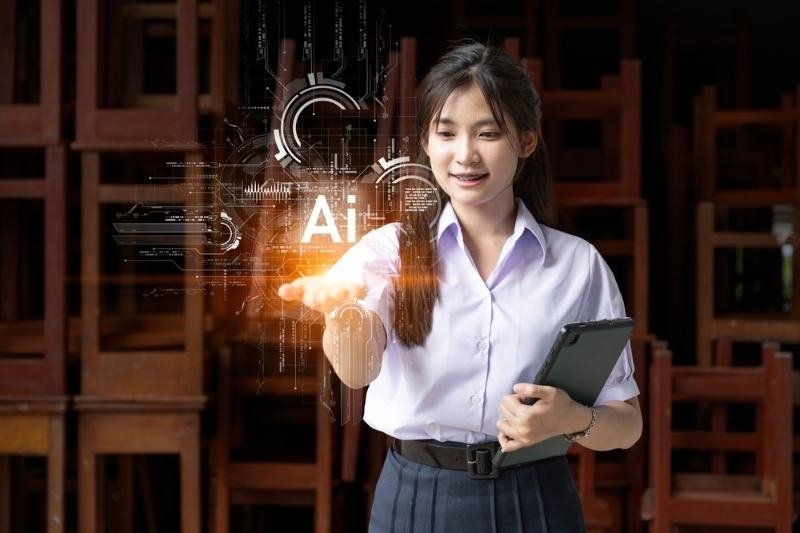 Student holding a tablet and interacting with a futuristic artificial intelligence interface