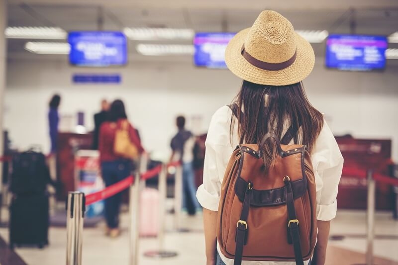woman at airport waiting for flight