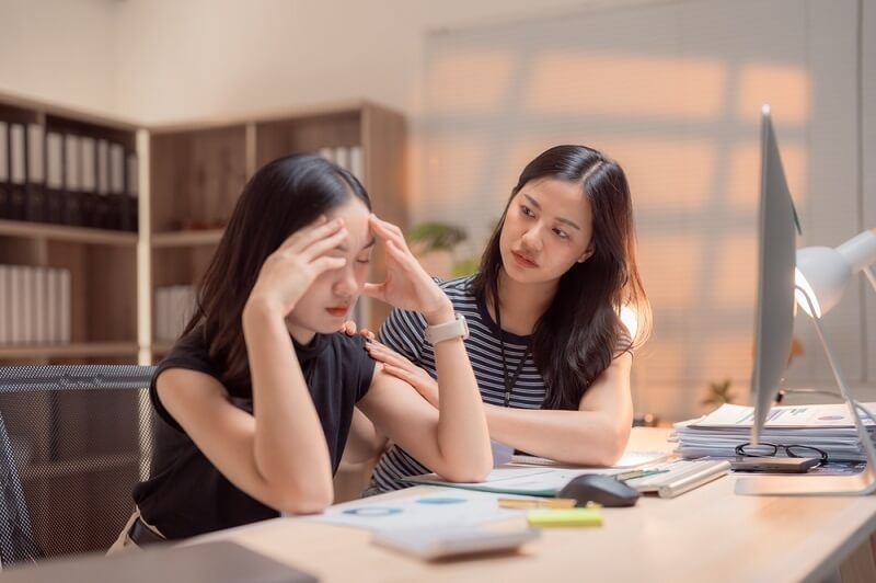 asian employee feeling burnout at work