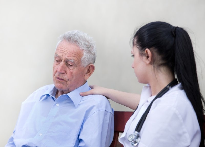 Caregiver supporting an older adult living with a heart condition