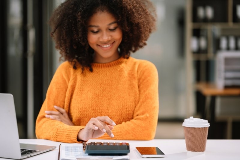woman auditing her monthly expenses 
