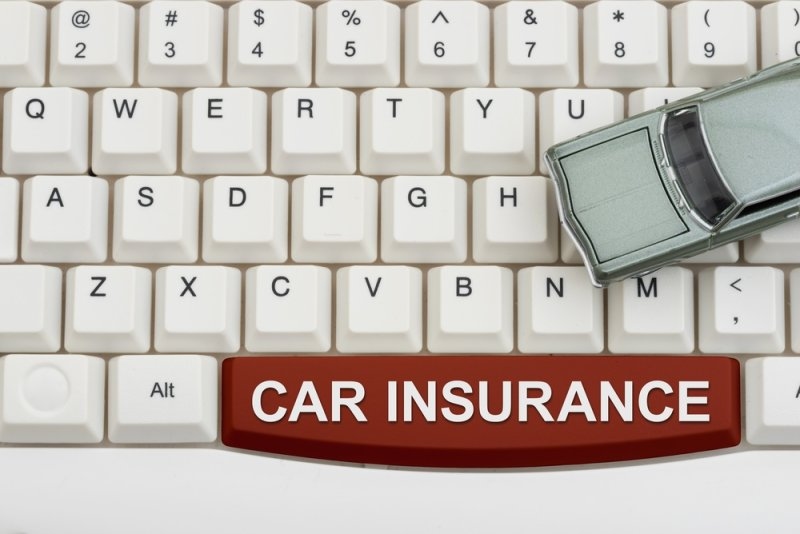 Car insurance text on space bar on a keyboard