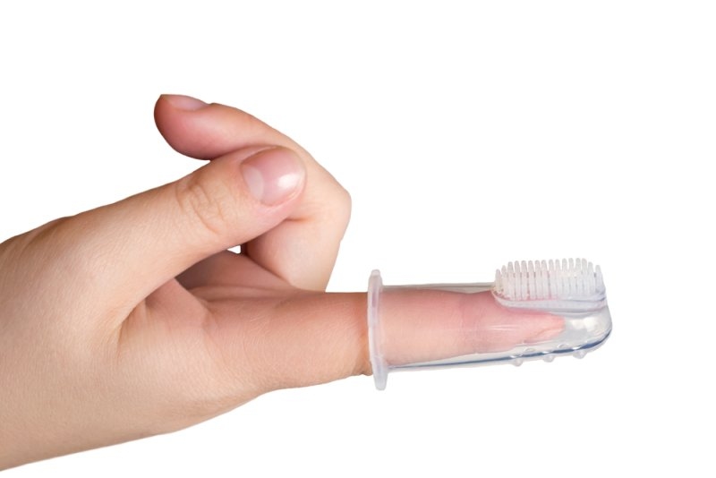 Infant finger toothbrush designed to gently clean a baby's teeth and gums during teething.