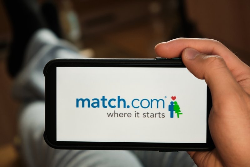 Smartphone displaying the Match.com logo and tagline “where it starts.”