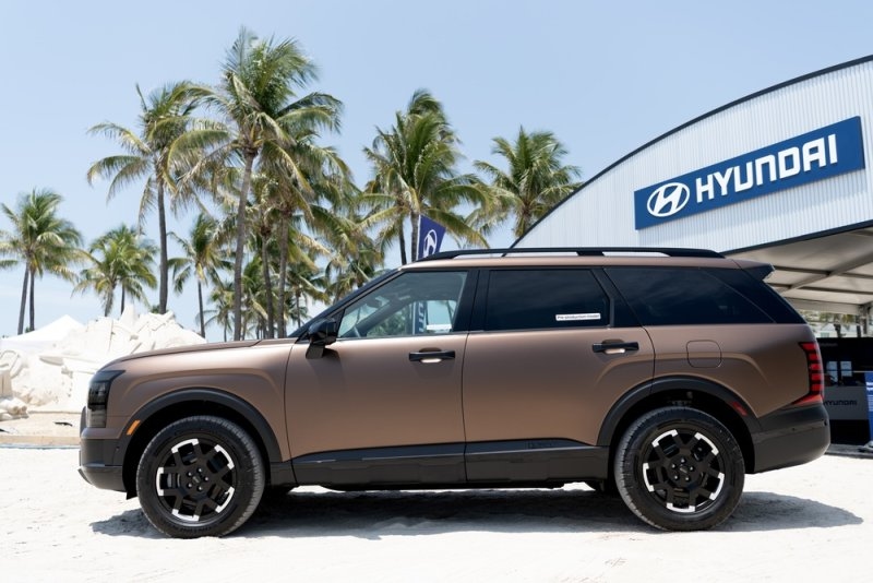 A brown Hyundai SUV photographed outdoors.
