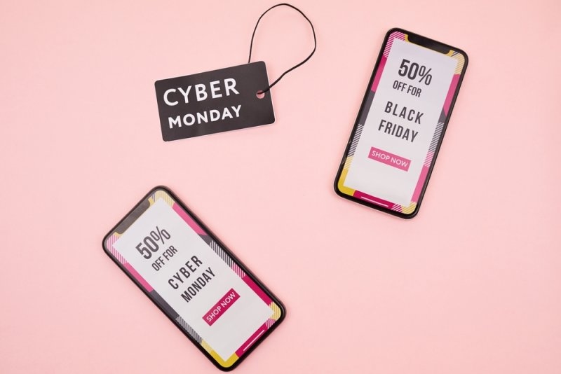 High angle view of smartphone screens with shopping banner