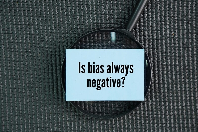 bias negative impact text with magnifying glass