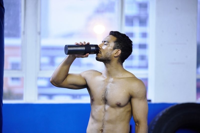 boxer drinking water at gym