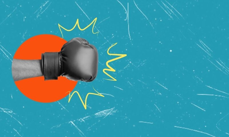 creative image of hand with boxing gloves in blue background