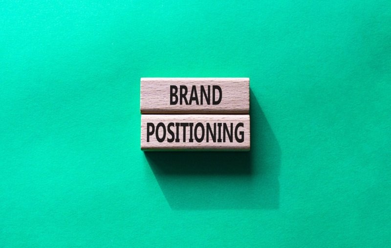 Text  Brand Positioning printed on two wooden blocks