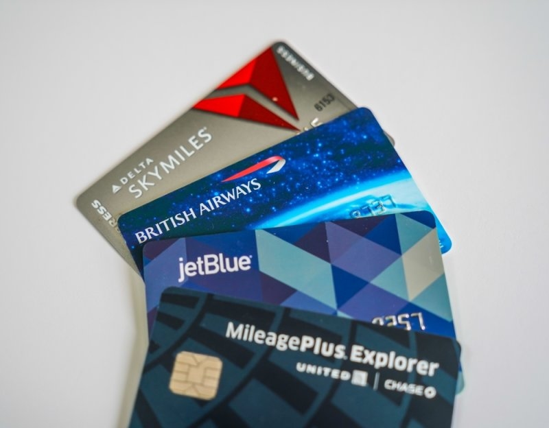 4 airline miles credit cards kept together