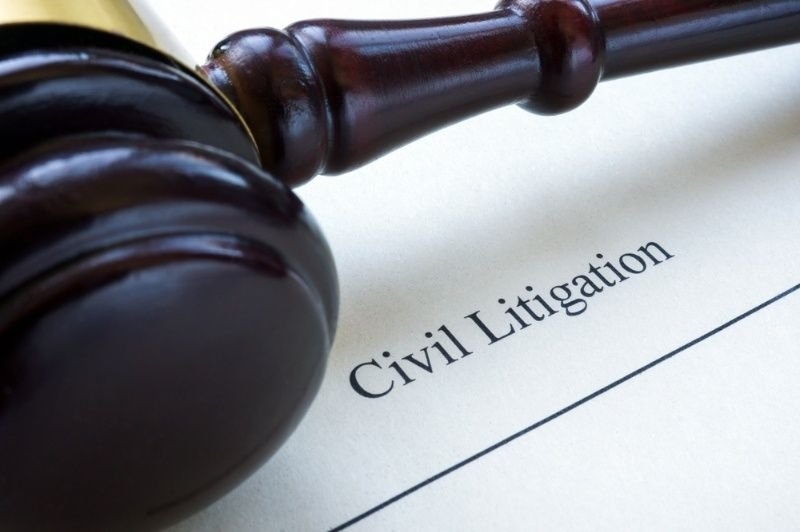 Judge's gavel resting on a legal document labeled 